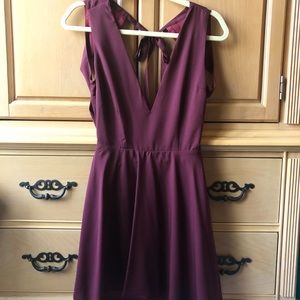 A maroon/burgundy swing dress with an open back
